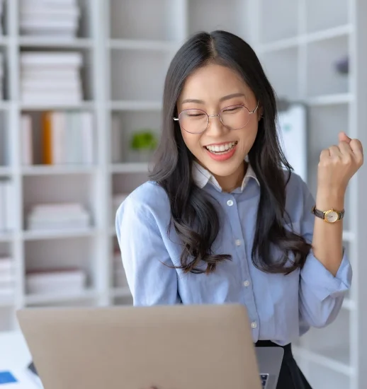 happy-asian-businesswoman-raising-hands-with-victo-2023-11-27-05-11-00-utc
